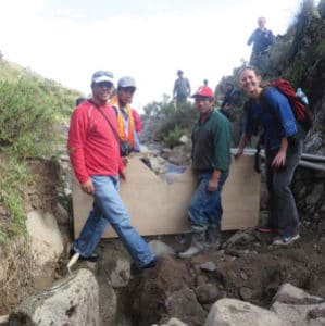 Figure 3. CONDESAN’s Luís Acosta works with community members to install weirs in paired microwatersheds to evaluate the impact of reducing cattle in the high grasslands on water availability in the dry season.